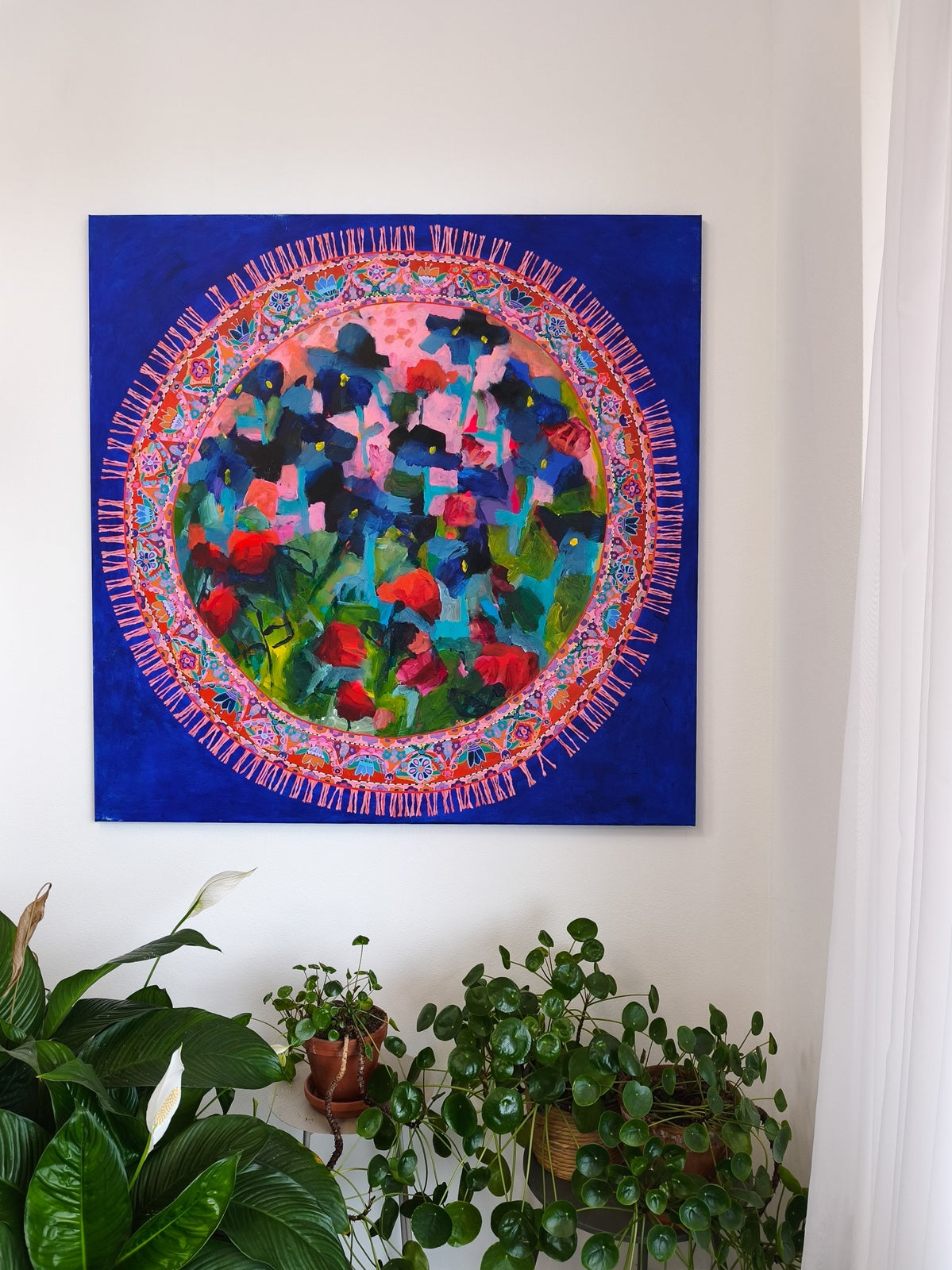 Abstract floral painting Blooming Rug styled with real flowers underneath, soft pink and blue tones